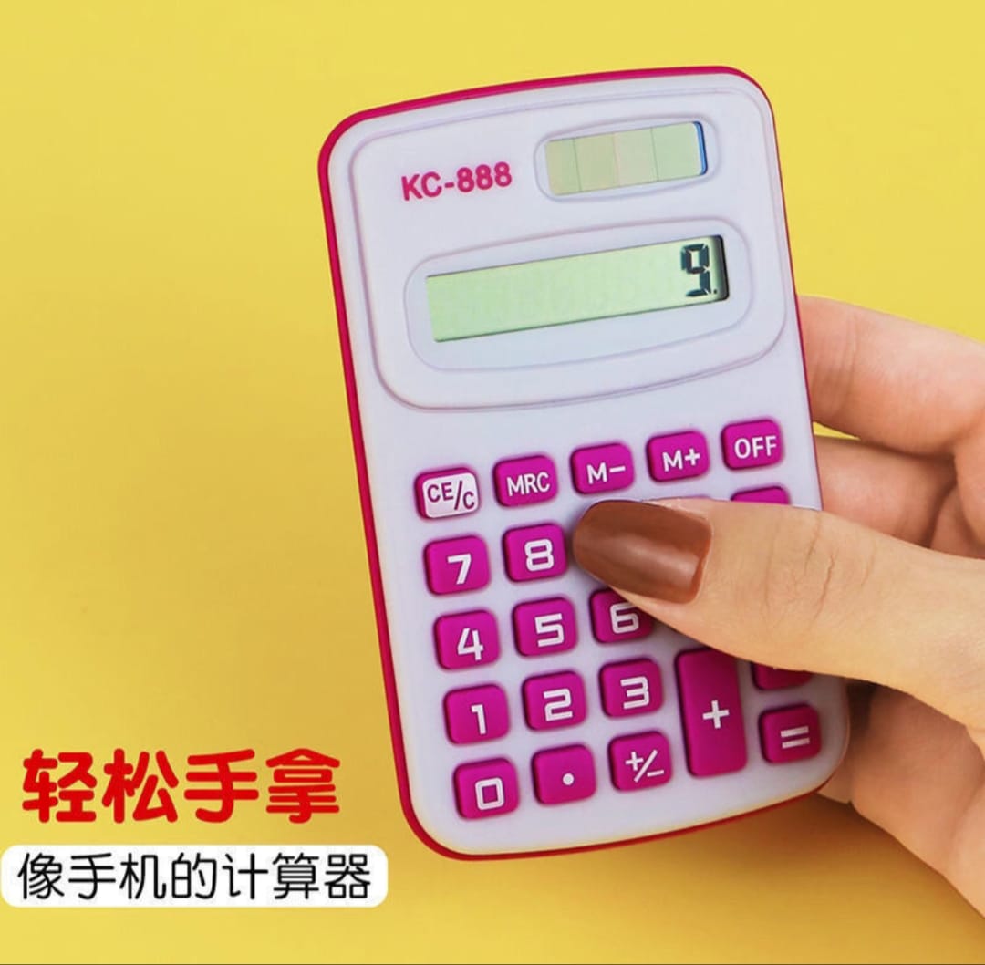 Small pink calculator held by a hand on a yellow background