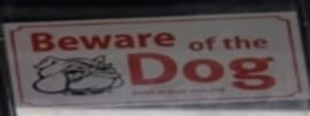 Beware of the Dog sign with a dog illustration on a white background