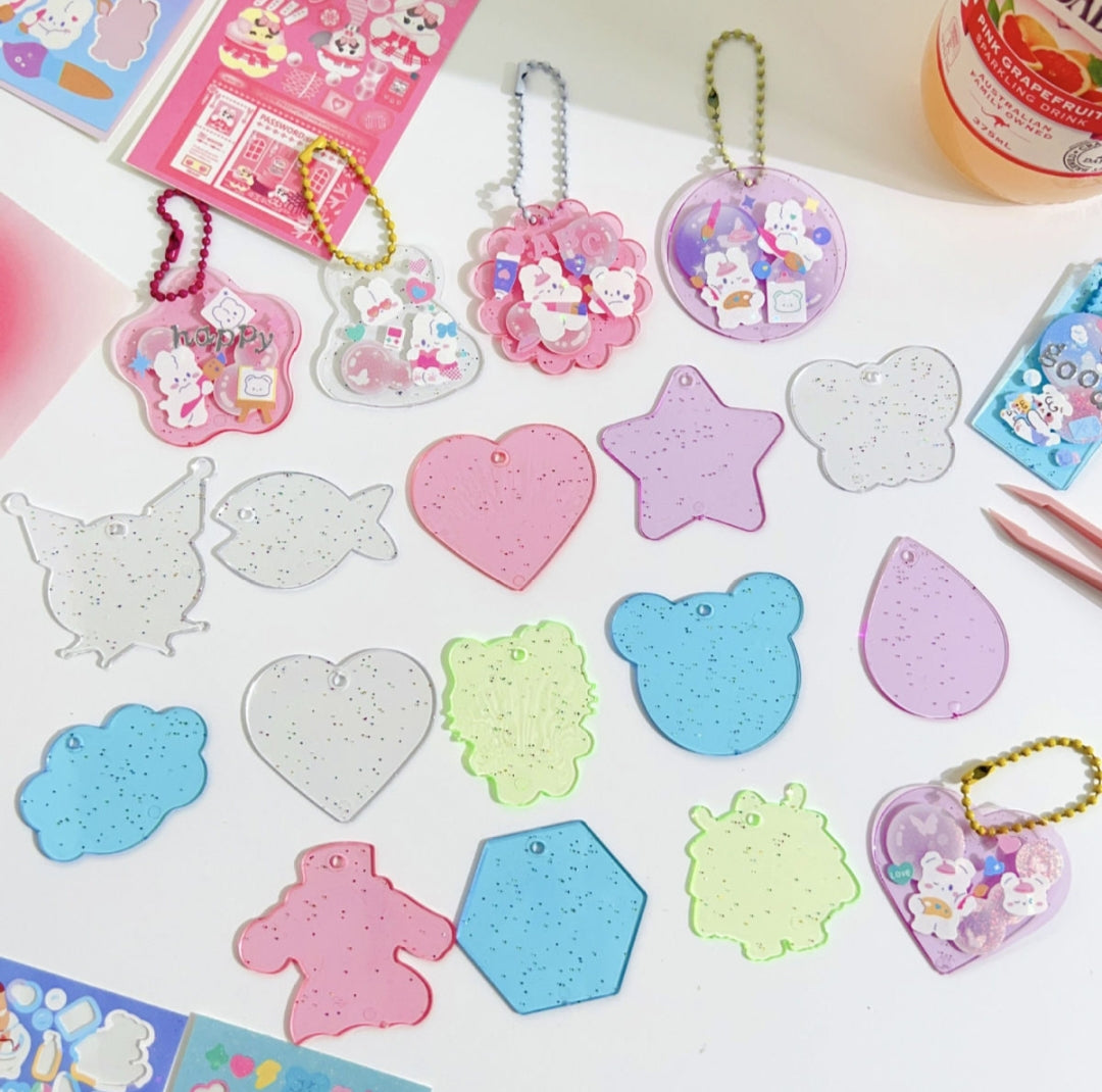 Colorful decorative stickers and keychains on a white surface