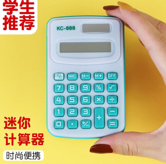 Hand holding a small calculator with a yellow background