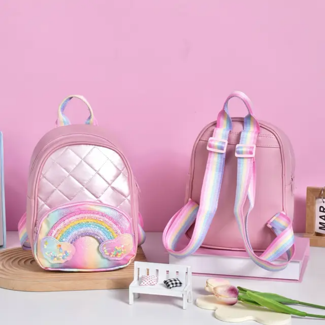 Rainbow Backpack – Colorful & Compact Kids’ Bag with Mixed Designs (17×8×22 cm – 118805)

Brighten up your child’s day with our Rainbow Backpack, featuring eye-catching mixed color designs and a compact, kid-friendly size of 17×8×22 cm. Designed for comfort and style, this lightweight backpack is perfect for carrying toys, snacks, stationery, or small essentials on the go.

Whether it’s for school, a fun outing, or gifting, the cheerful rainbow theme makes it a favorite among kids and a great choice for ret