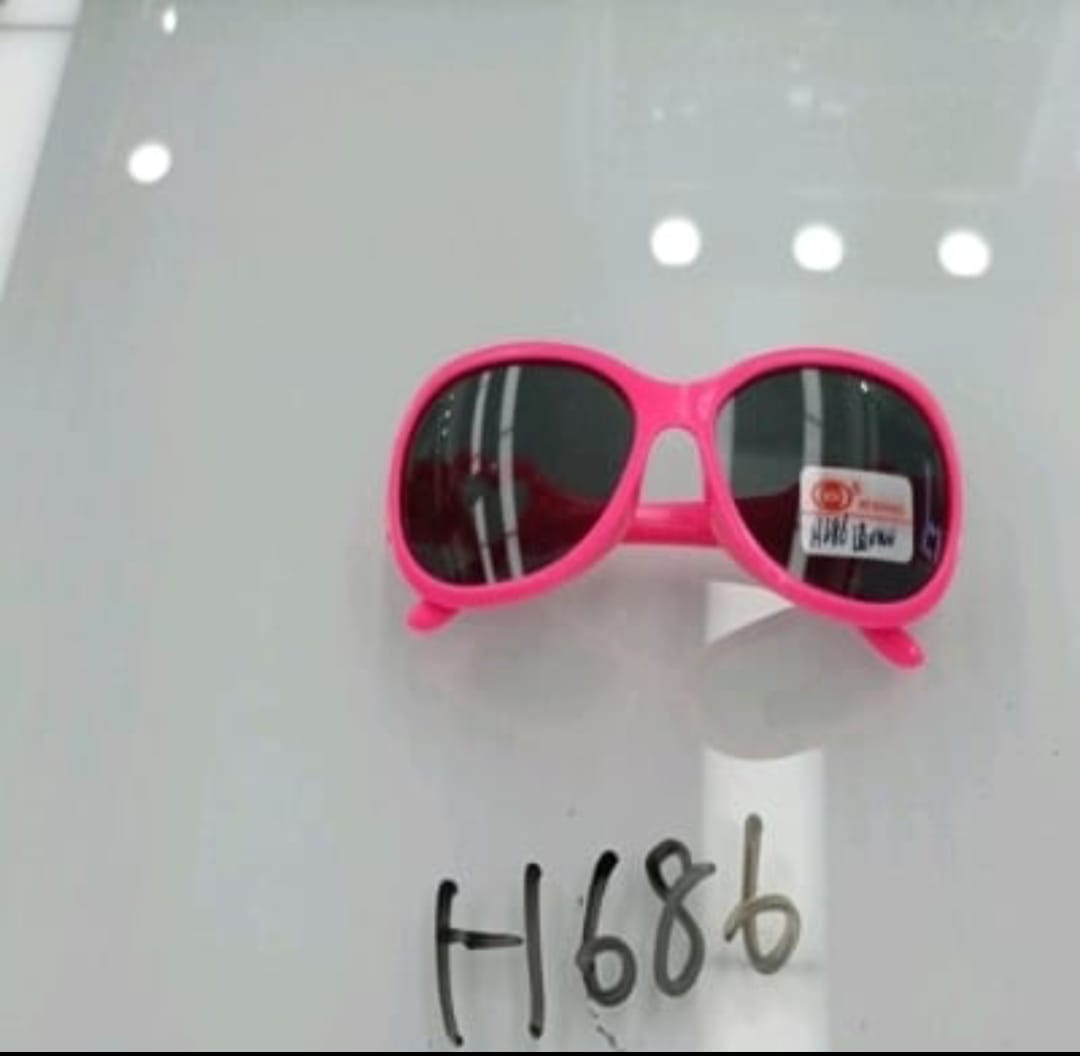 Pink sunglasses with a visible brand label on a white background