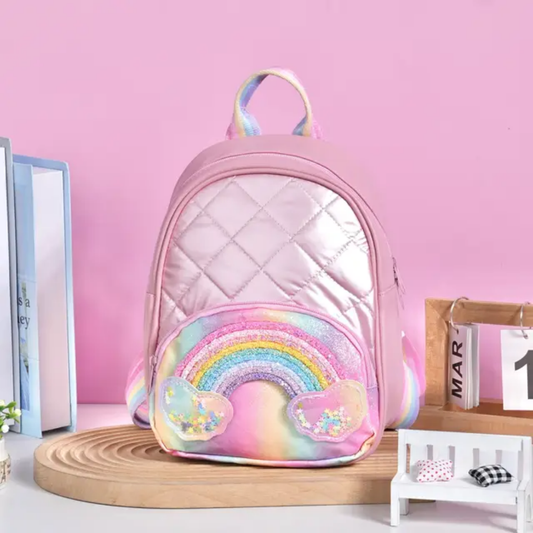 Rainbow Backpack – Colorful & Compact Kids’ Bag with Mixed Designs (17×8×22 cm – 118805)

Brighten up your child’s day with our Rainbow Backpack, featuring eye-catching mixed color designs and a compact, kid-friendly size of 17×8×22 cm. Designed for comfort and style, this lightweight backpack is perfect for carrying toys, snacks, stationery, or small essentials on the go.

Whether it’s for school, a fun outing, or gifting, the cheerful rainbow theme makes it a favorite among kids and a great choice for ret