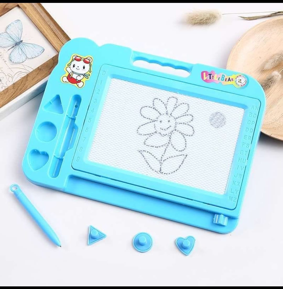 Blue drawing board with floral design and accessories on a white surface