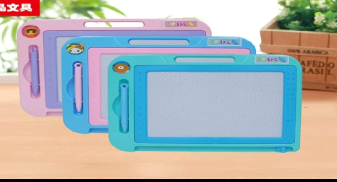 Three colorful drawing boards with handles on a wooden surface.