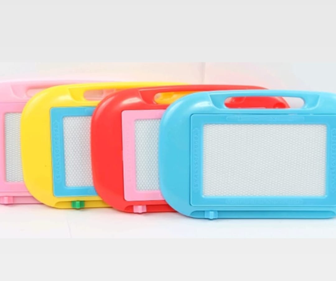 Four colorful drawing boards with magnetic features on a white background