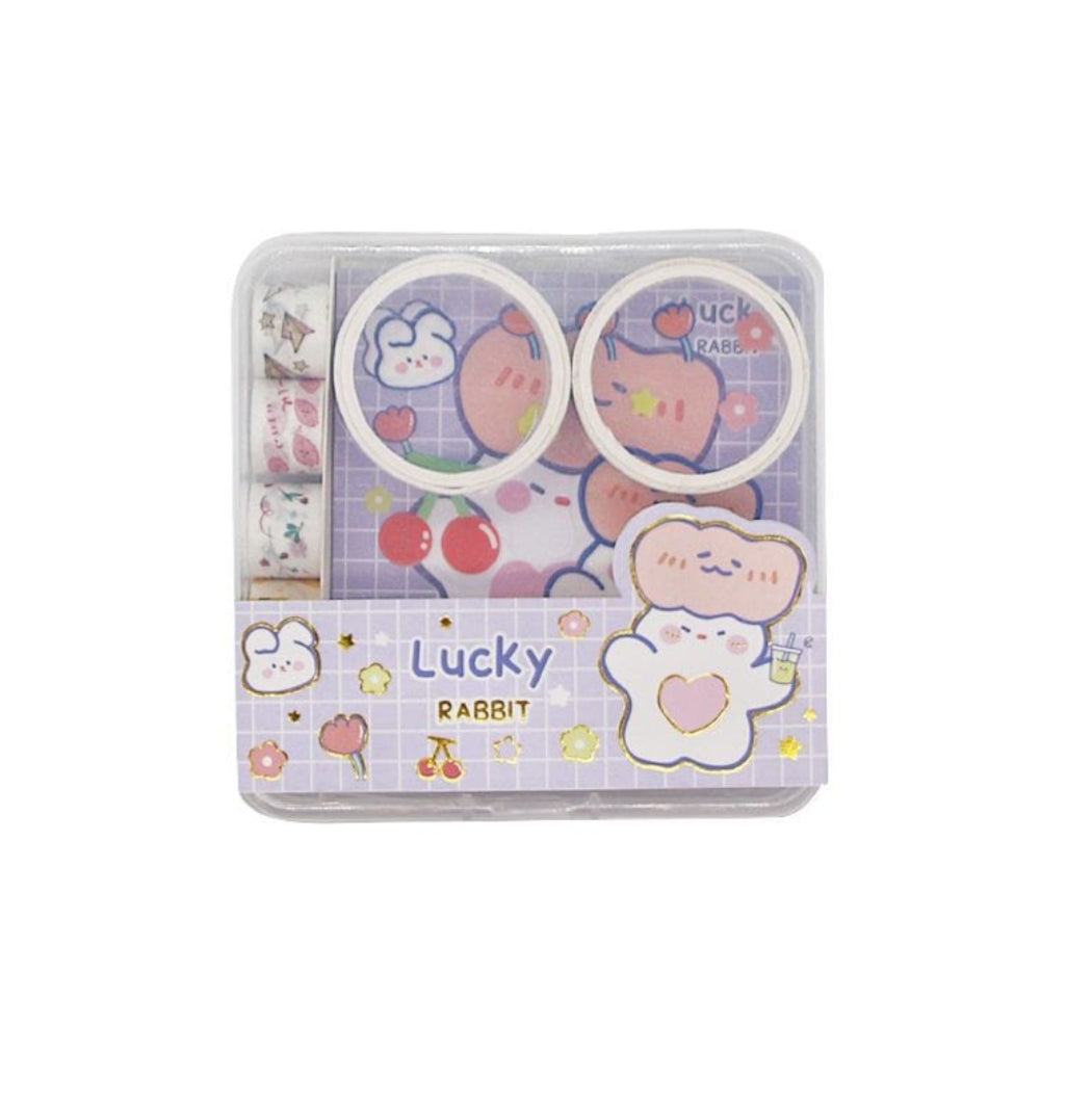Cute stationery set with cartoon designs in a clear plastic case on a white background