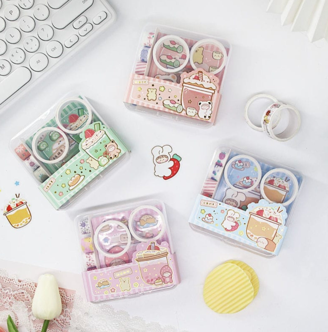 Set of cute stationery items including washi tape and stickers on a white surface.