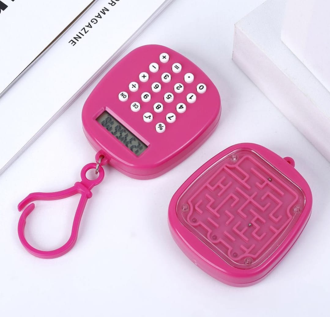 Pink maze toy with calculator-like keypad on a white surface
