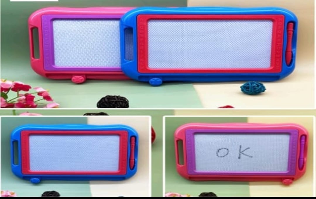 Two colorful magnetic boards with writing on a light green surface.