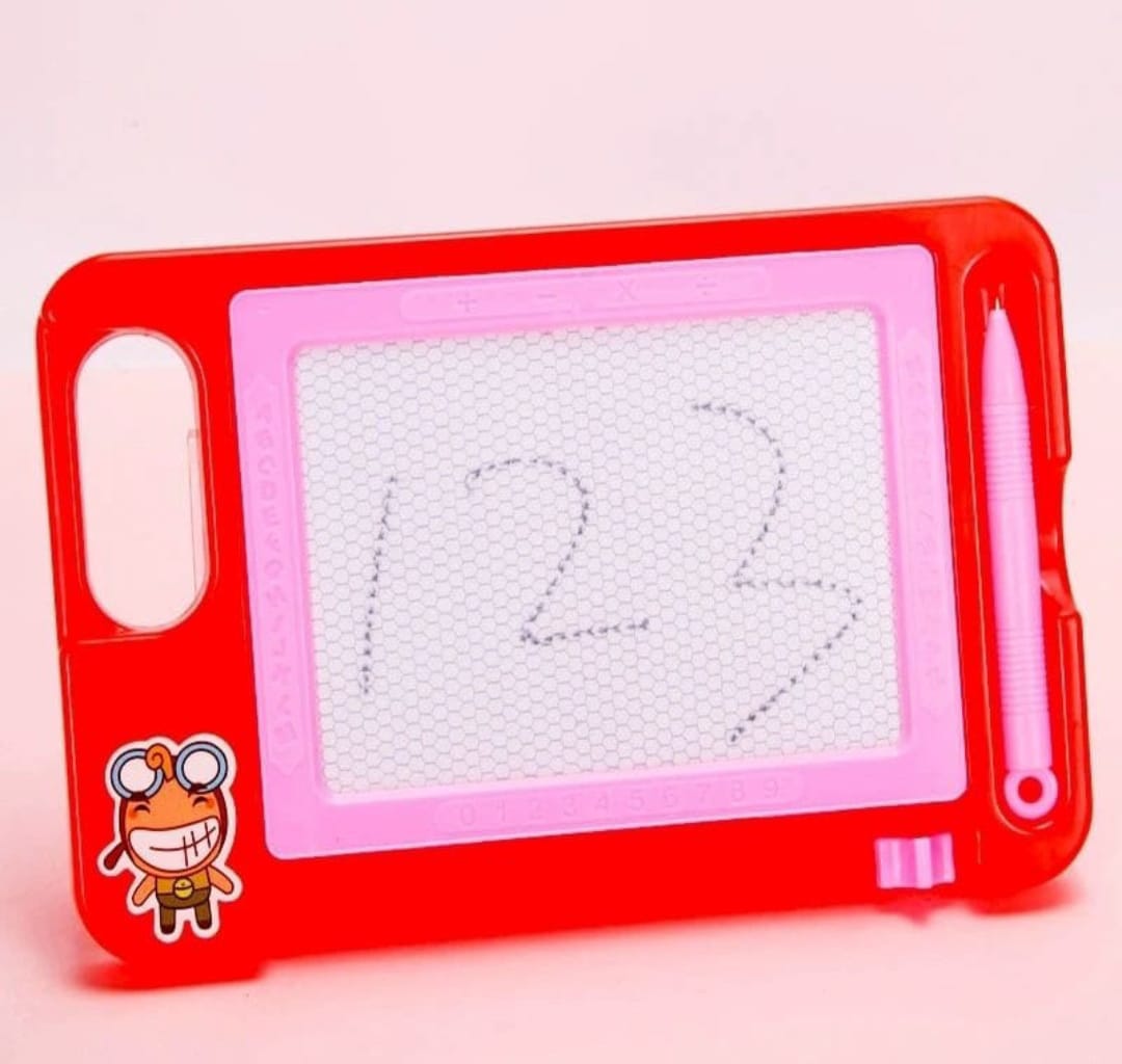 Red and pink children's drawing board with a heart drawing on a light pink background