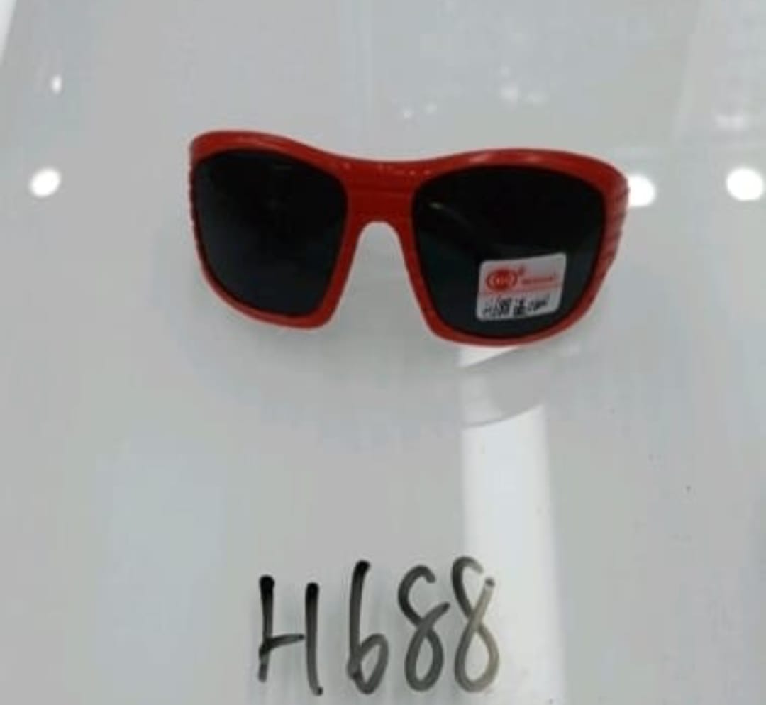 Red sunglasses with a visible brand label on a white background
