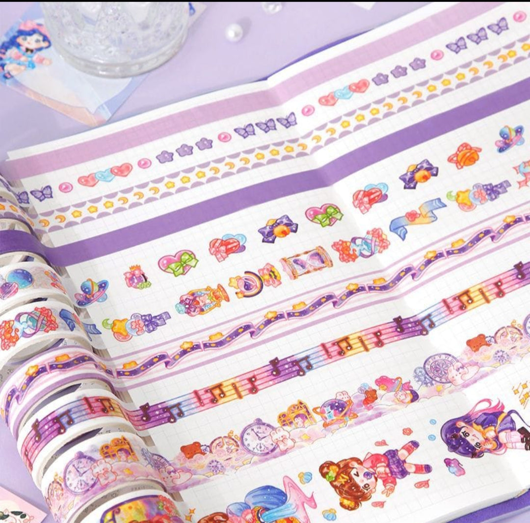 Colorful decorative tape rolls with cartoon designs on a purple surface.