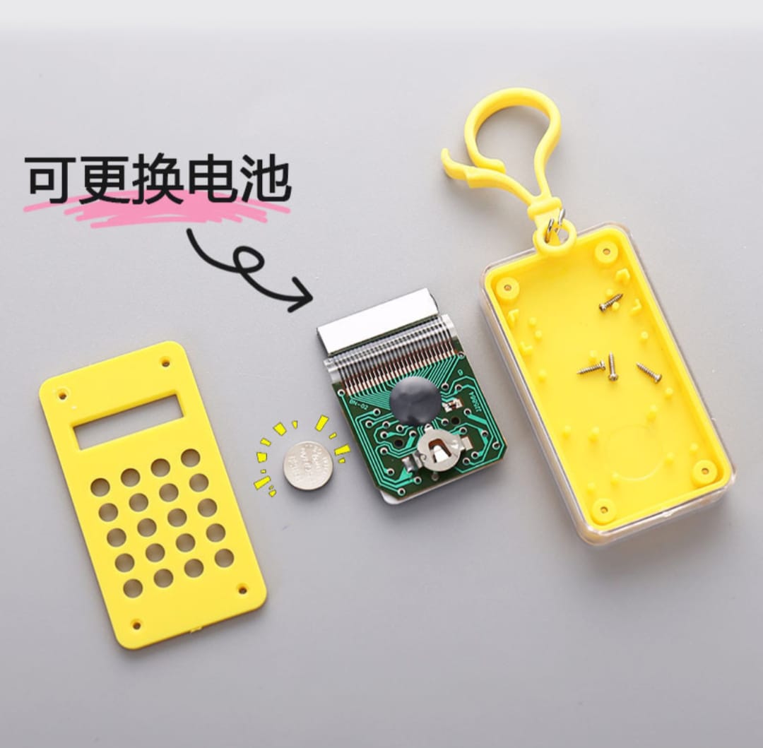 Yellow electronic keychain with battery replacement feature on a gray background